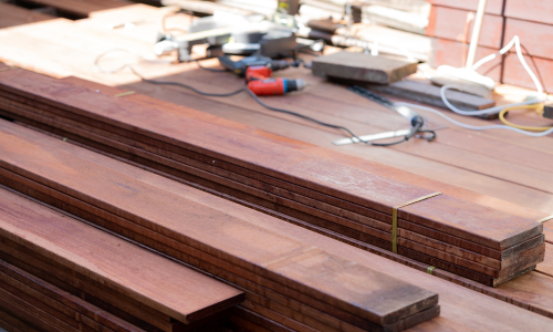 Stacked decking materials, ready to be used for a build.